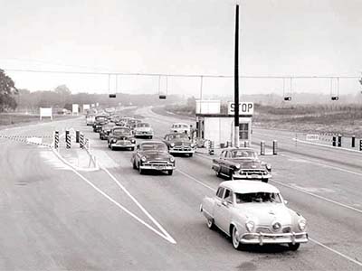 Cars passing through the Savannah River Site security checkpoint, 1950s.