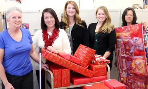 SCSL staff members with gifts