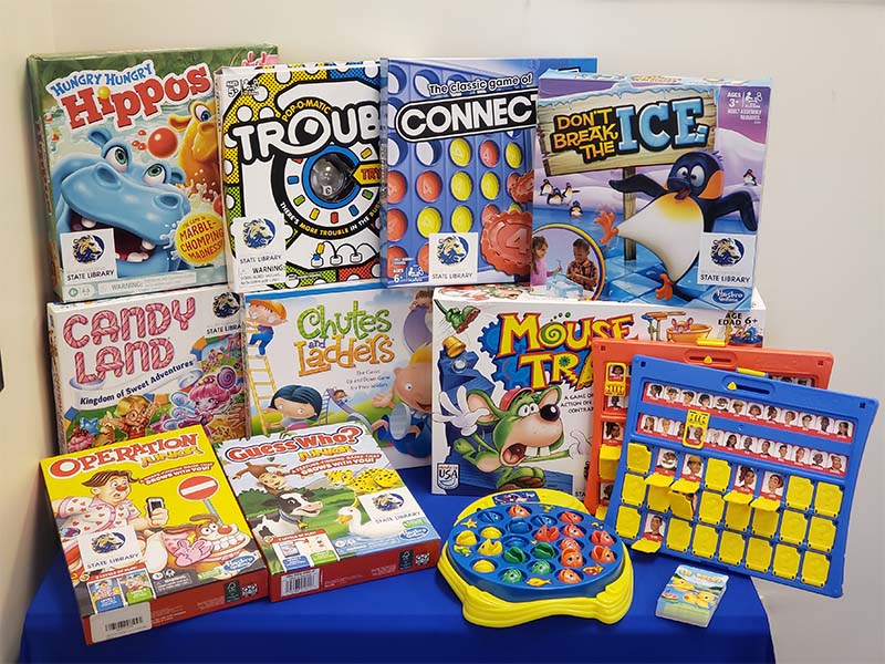 Image of classic kid's board games on a table.