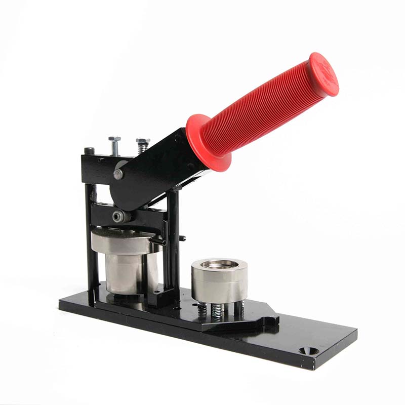 Image of the button maker with a red handle on a white background.