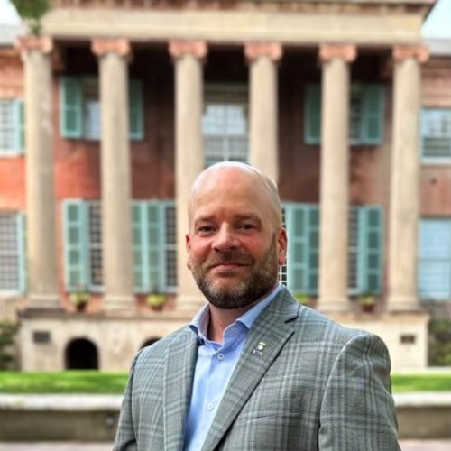 Photo of historian Chad Gibbs in front of the College of Charleston