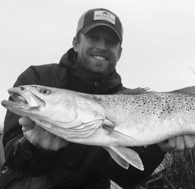 Photo of Douglas Cutting holding a fish.