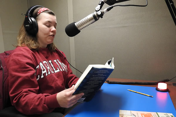 Woman recording a book for Talking Book Services.