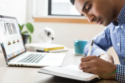 image of man at laptop