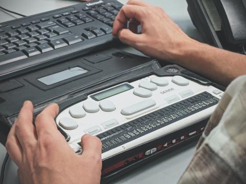 photo of person using a keyboard