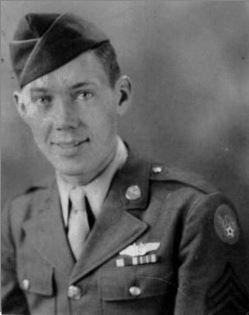 A black and white photo of a military soldier in uniform.